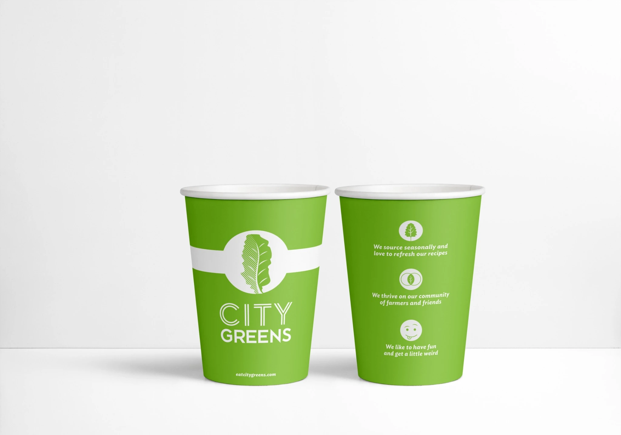 Front and back views of the paper cup design.
