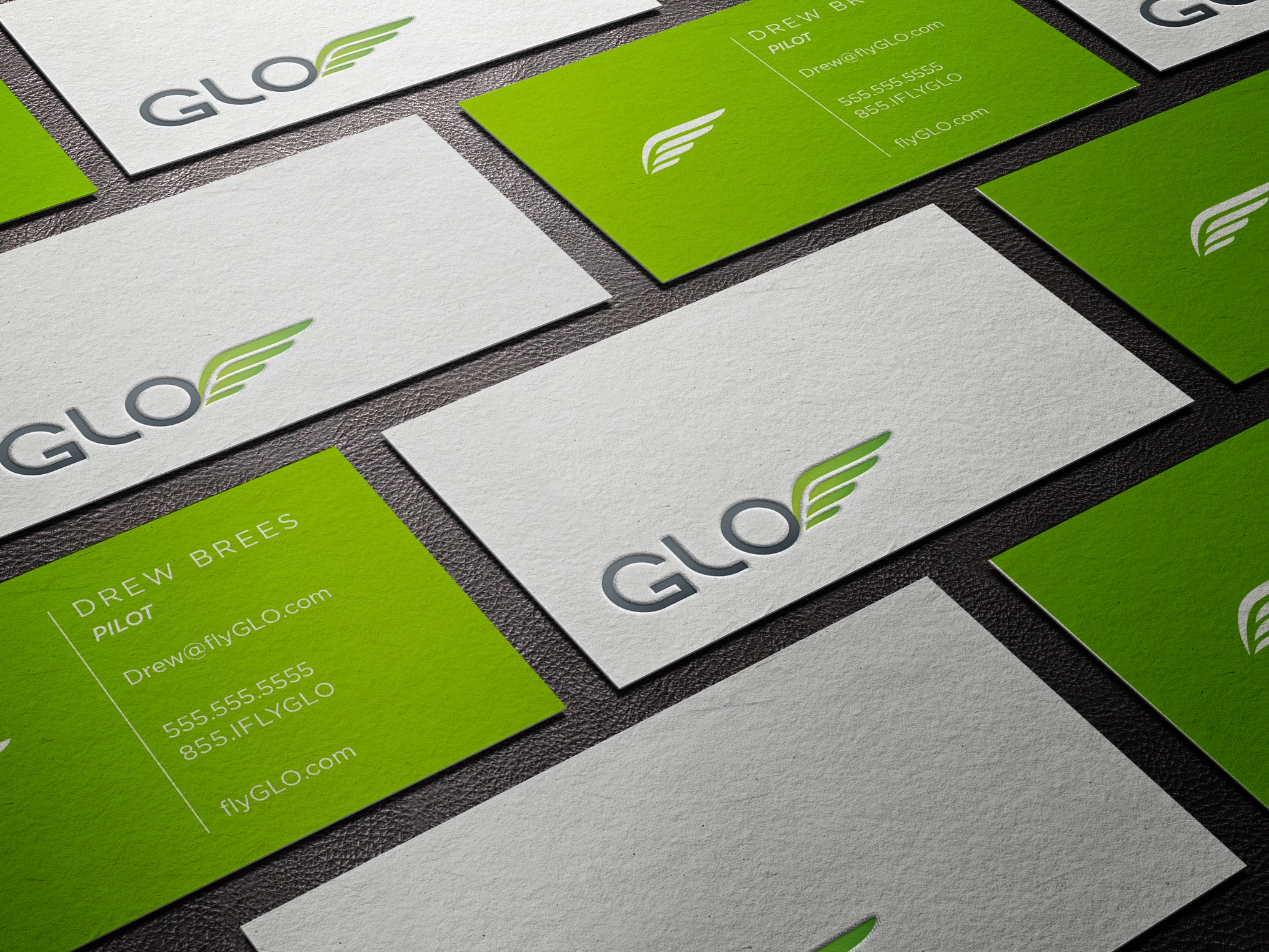 Business cards carrying the GLO visual identity.