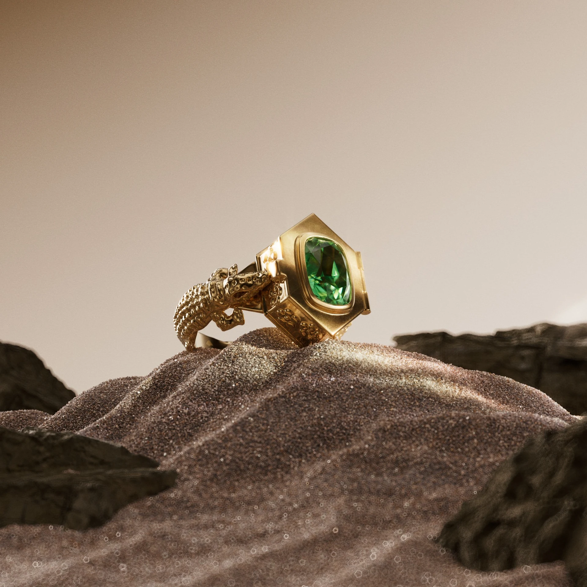 The green gemstone ring on a sculpted surface.